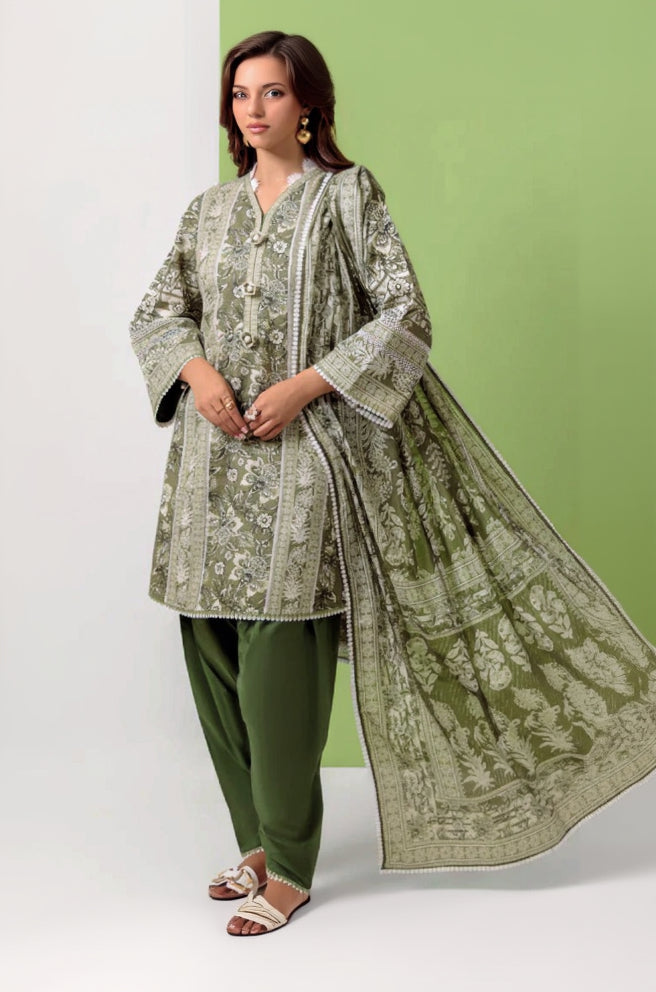 Woman wearing a green and white traditional outfit with Bonanza Satrangi branding.