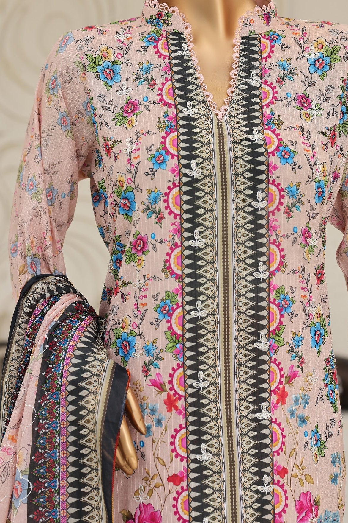 Floral embroidered dress with intricate patterns on a neutral background
